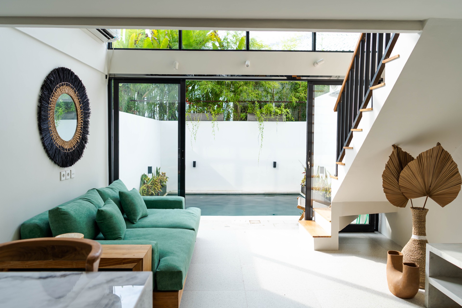 Living room opening to private pool